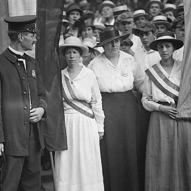 Group of suffragists picketing. 