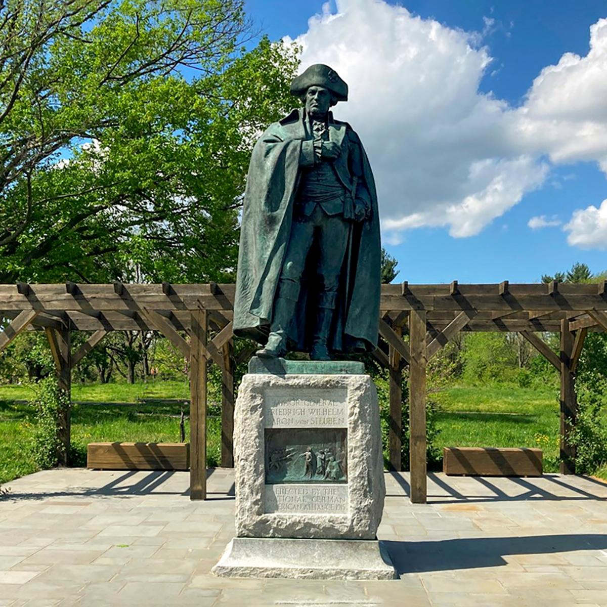 State of a soldier wearing a cloak and a tricorn hat