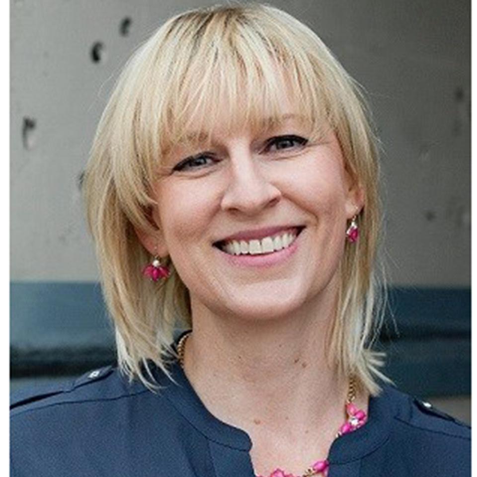 Portrait of Sally with a concrete wall in the background