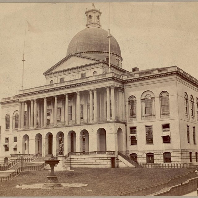 sepia photo of the MA state house, a federal-style government building