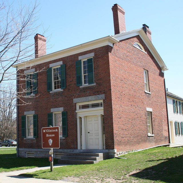 Photo of present-day M'Clintock two-story brick house. NPS photo. 