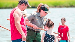 Park Ranger teaches visitors about clamming.
