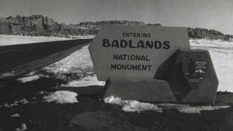 a historic black and white photo of the original park sign: 
