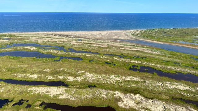 A vast expanse of rolling barren mountains within Bering Land Bridge National Preserve.