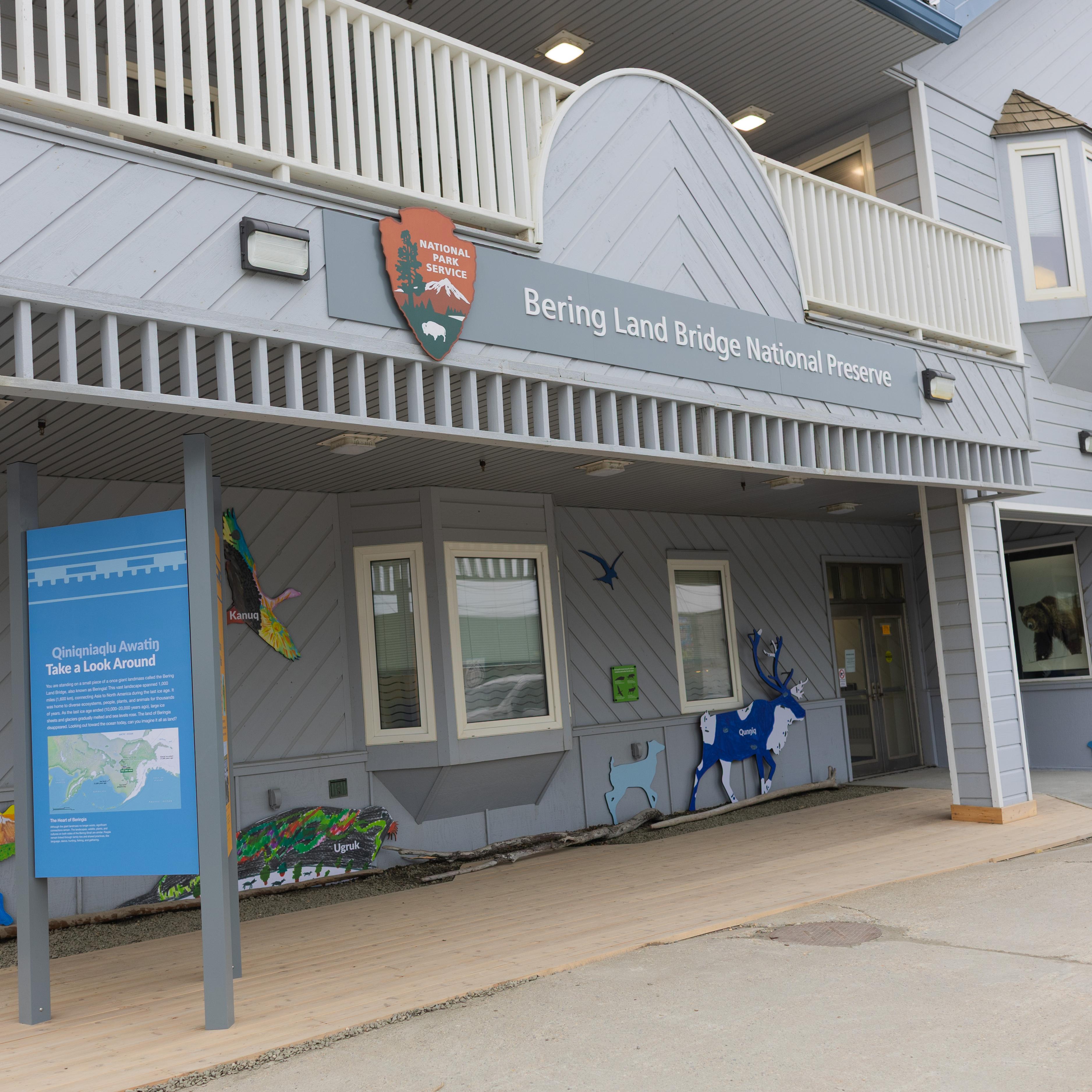 The entrance to the Bering Land Bridge Heritage Center with colorful animal cutouts and exhibits.