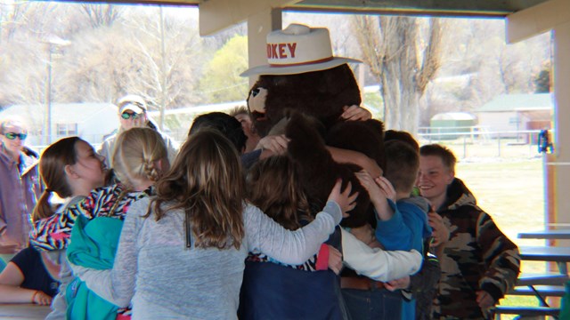 Bear hug for Smokey at Arbor Day event