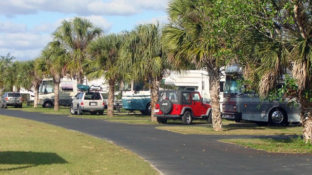 midway campground with cars and RVs