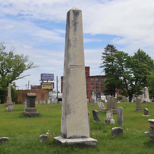 White obelisk in cemetery