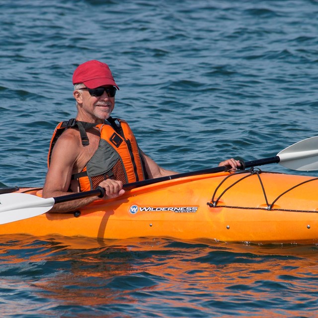 Kayaker paddling along the Blackstone