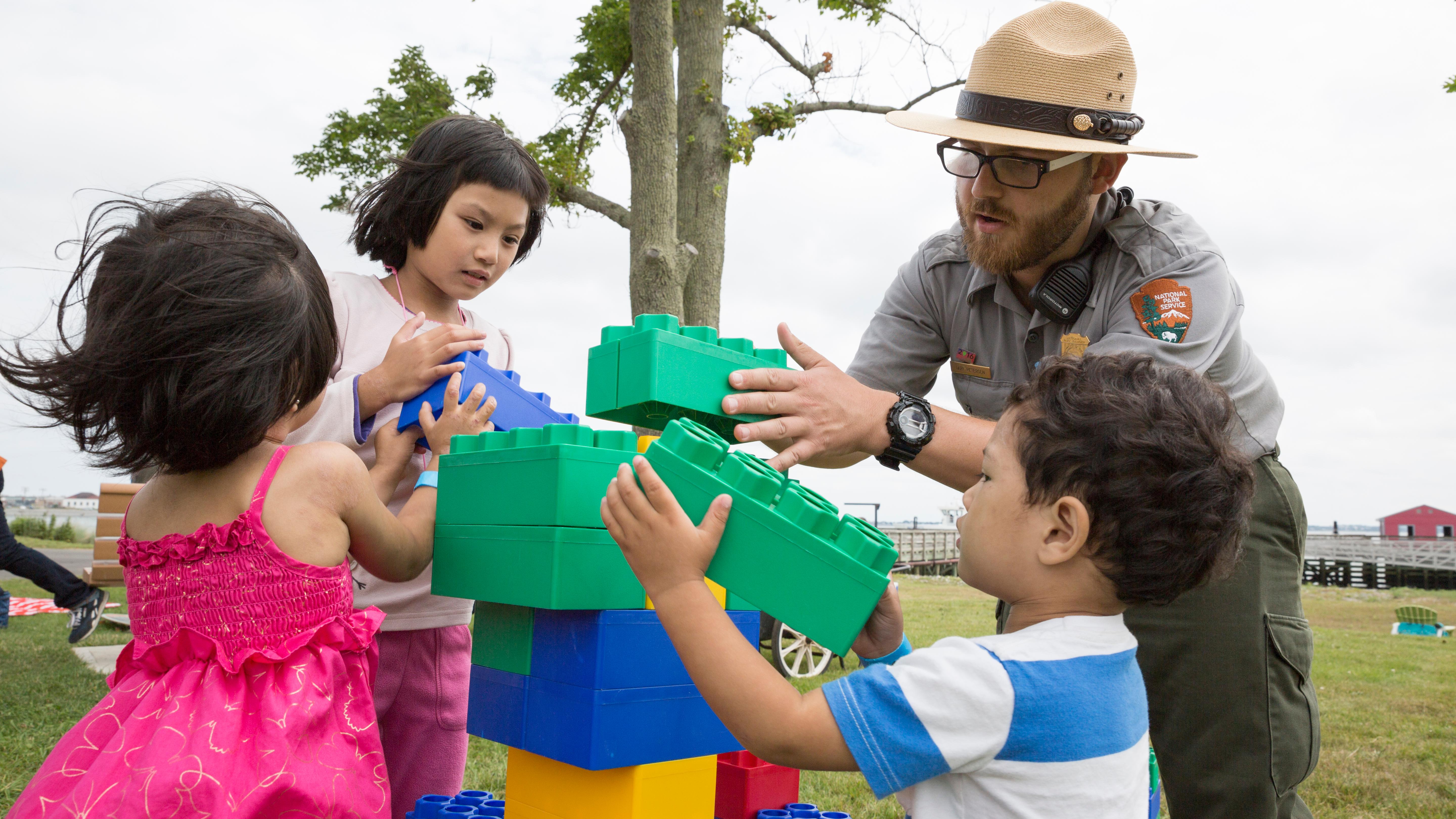 A ranger working with young visitors