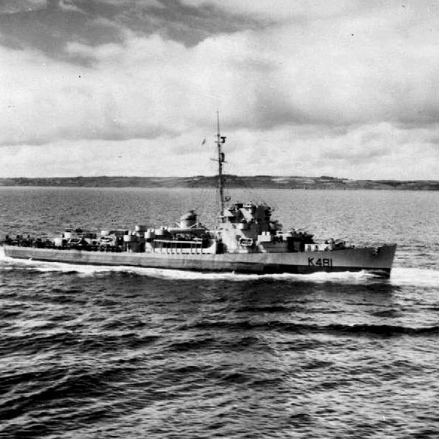 HMS Gore, a destroyer escort, sailing in the water. 