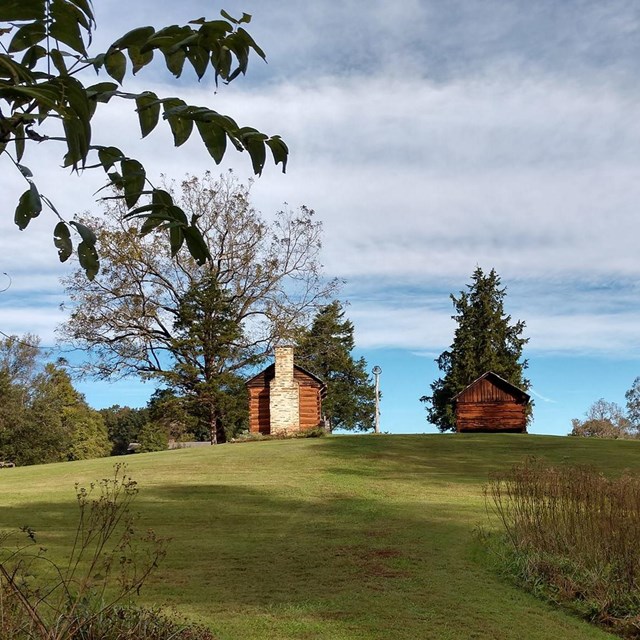 A landscape view of a green foreground with 