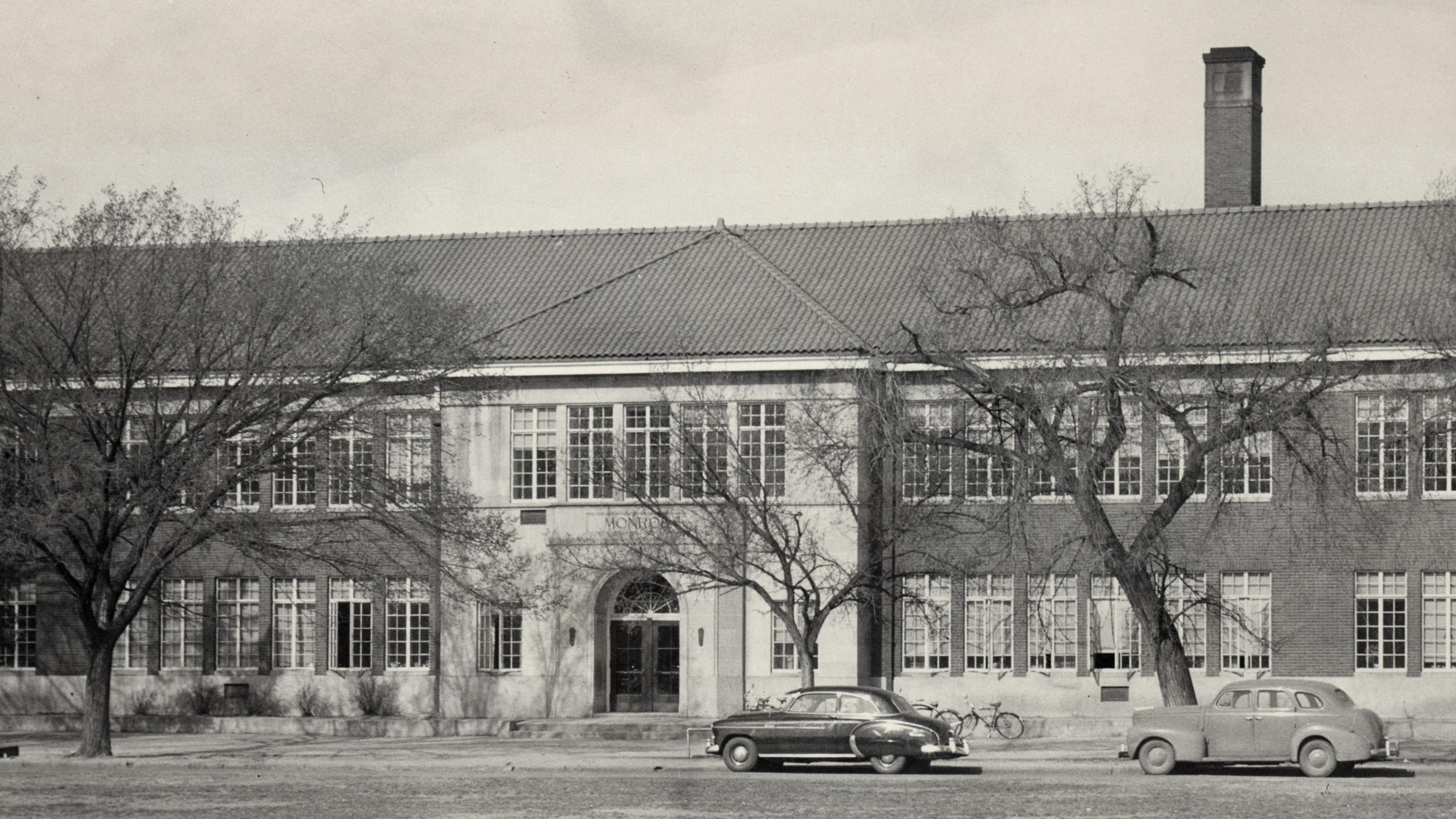 black and white photo of brick monroe elementary building