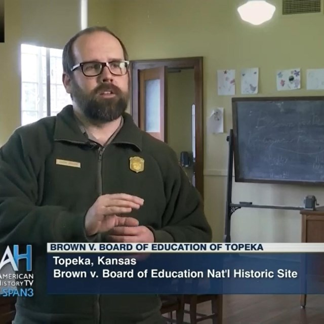 Park ranger stands in 1950's kindergarten room