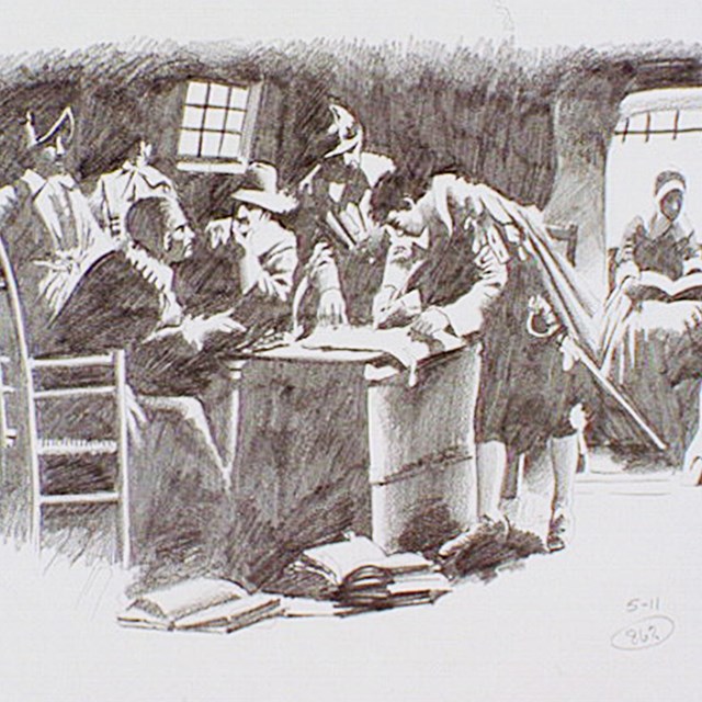 Group of pilgrims around a table sign a document, the Mayflower Compact.