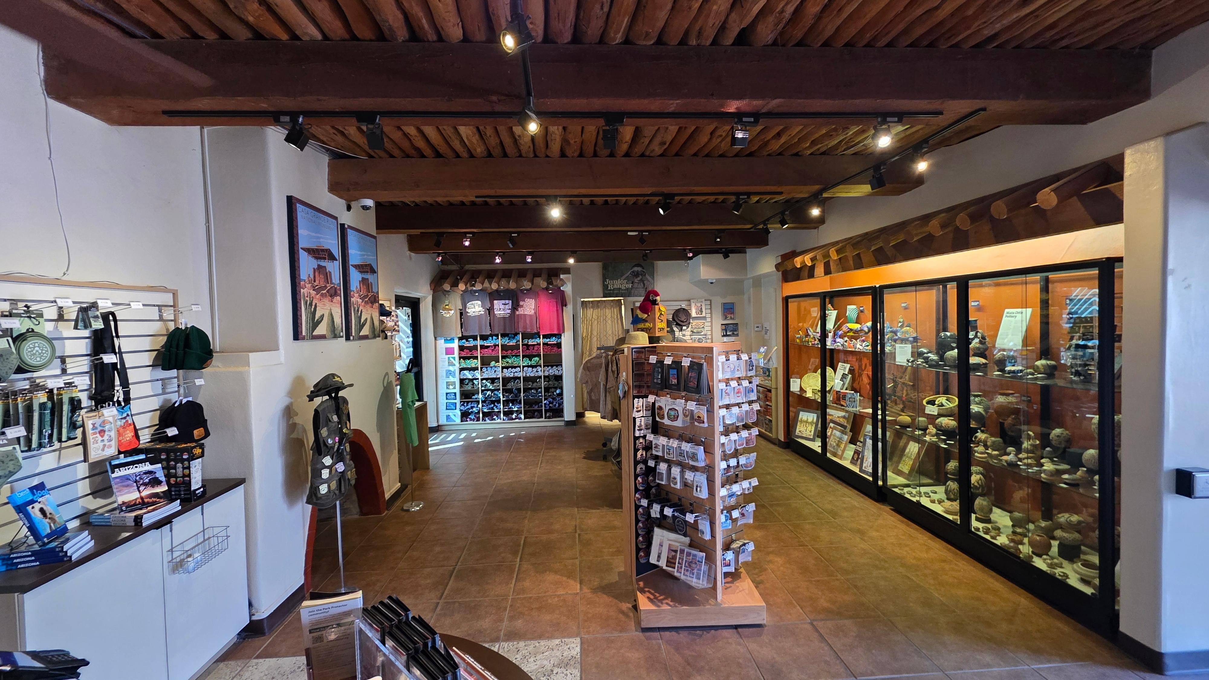 A view inside the bookstore with souvenirs, t-shirts, hats, and more products