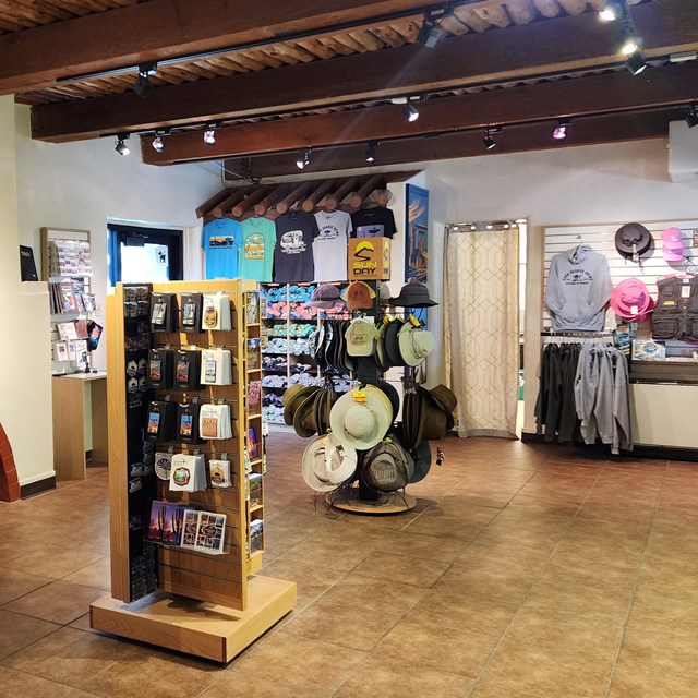 A view inside the bookstore with souvenirs, t-shirts, hats, and more products