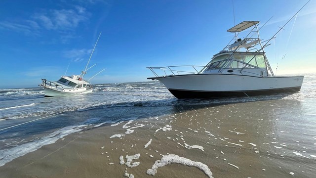 two vessels grounded on the beach