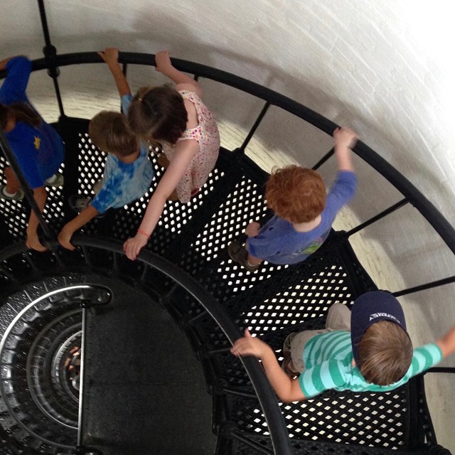 Children climbing lighthouse steps