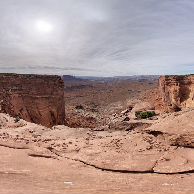 a panorama view of canyons and cliff walls