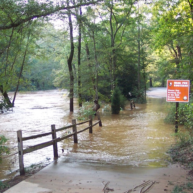 Flooded entrance road to Vickery Creek unit during the Flood of 2009.