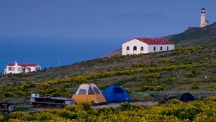 Campground on Anacapa Island with lighthouse in background. ©Tim Hauf, timhaufphotography.com