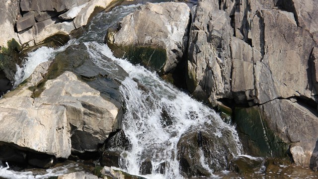 Potomac River water flowing over rocks.