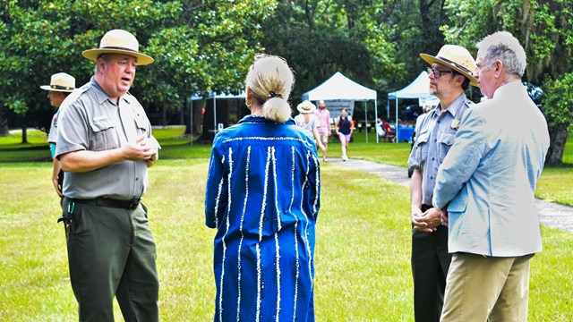 A Park Ranger speaks to a group of visitors