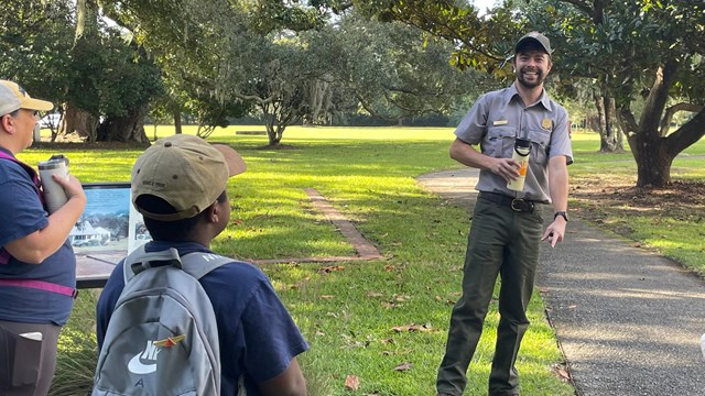 A Park Ranger speaks to a group of visitors