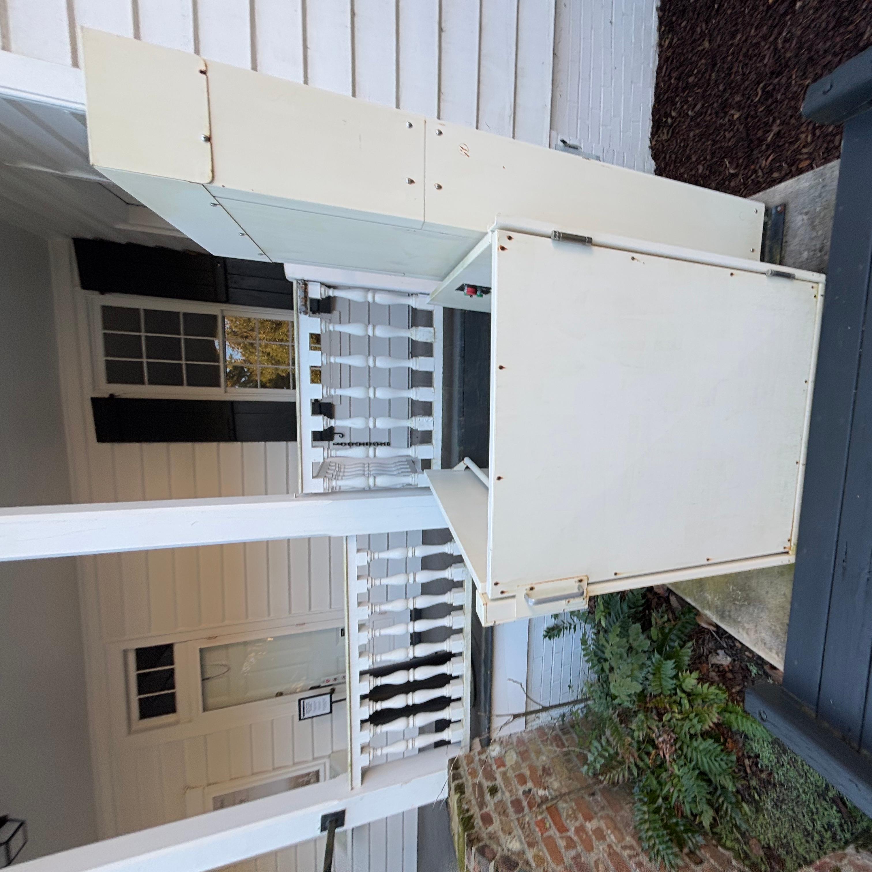 A small single-user lift to get from the ground level up onto the porch of the home.
