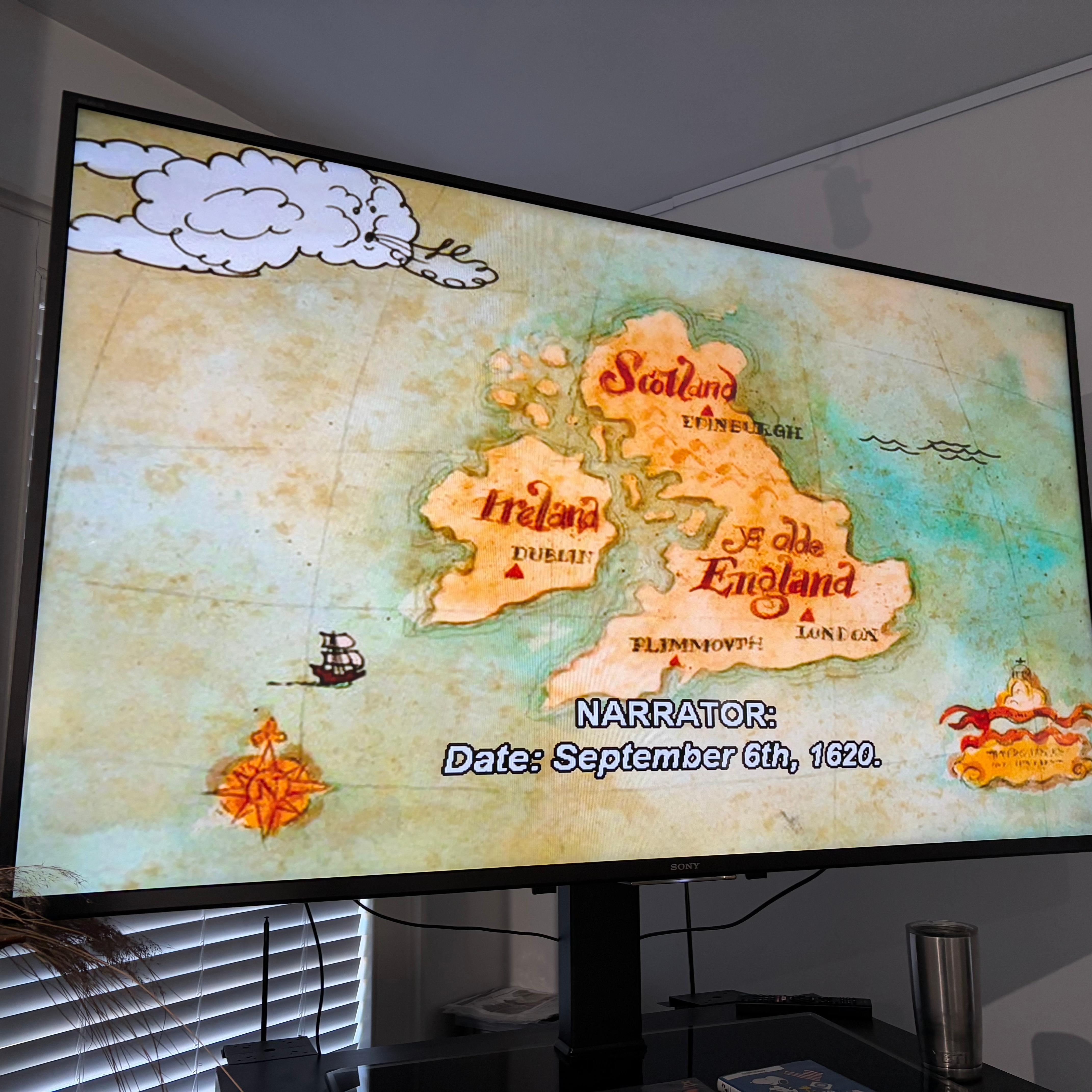 The screen of a tv with a video playing with captions on.