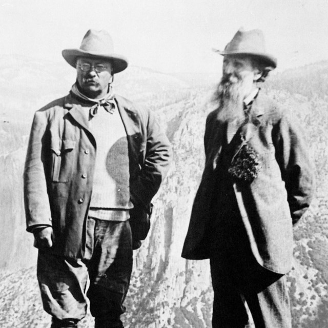 Theodore Roosevelt and John Muir in front of the Yosemite landscape