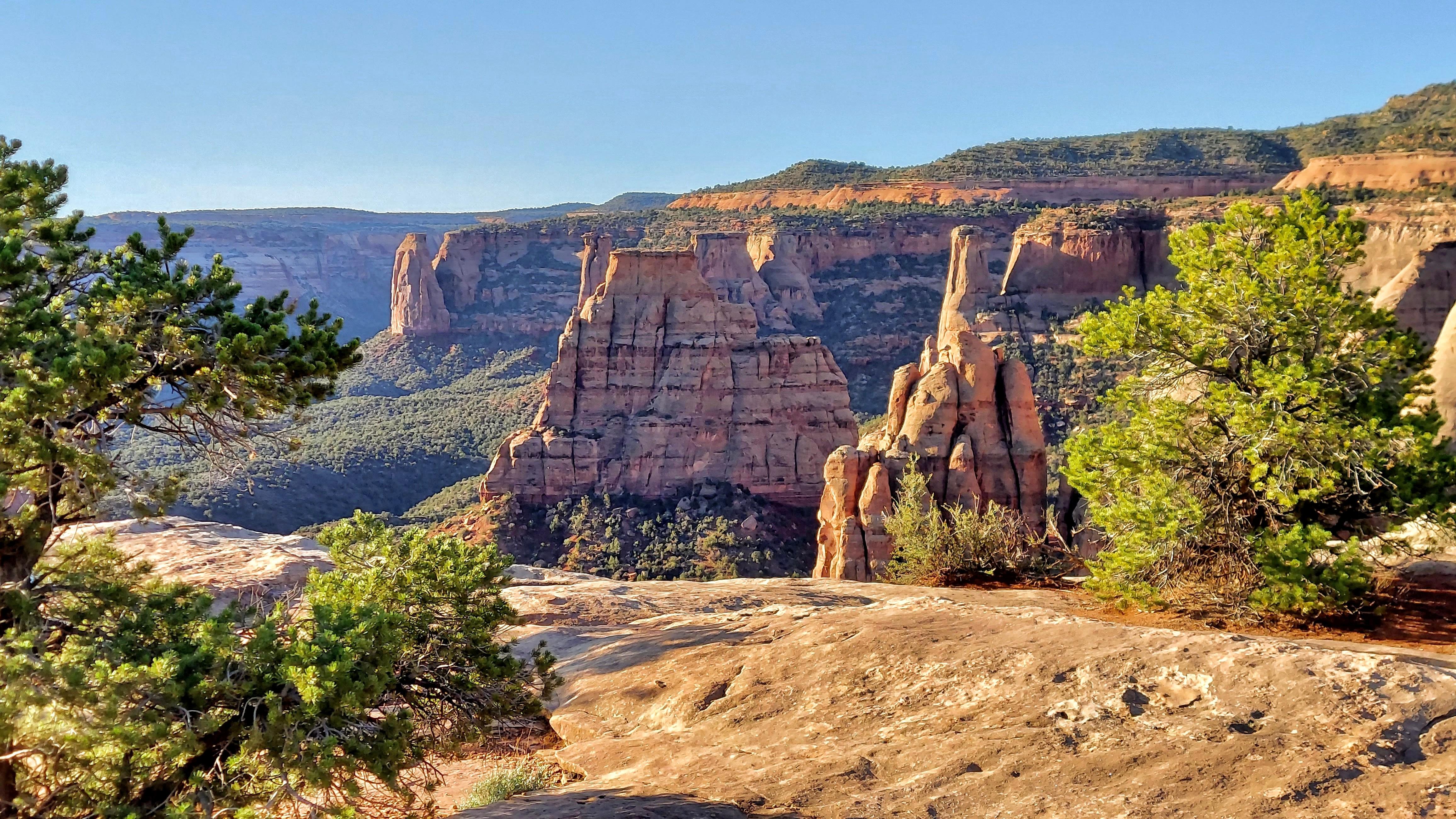 enormous red-orange rock towers in morning light