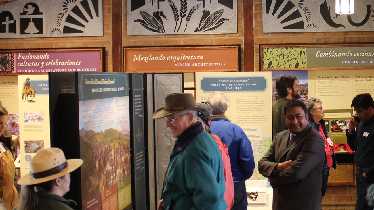 Gathering of visitors inspect the visitor center exhibits