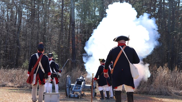 Reenactors fire cannon 