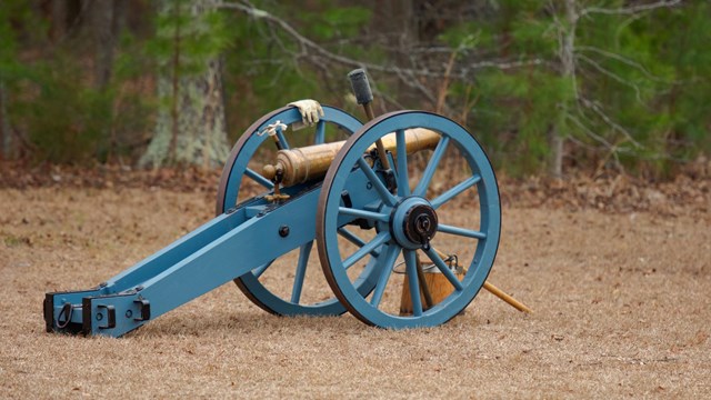 Grasshopper cannon with blue wheels