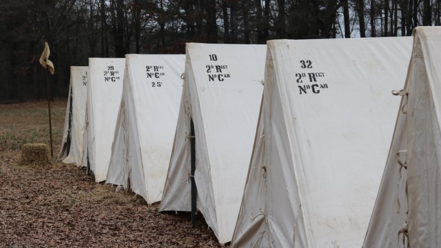 Several 18th century tents in a line