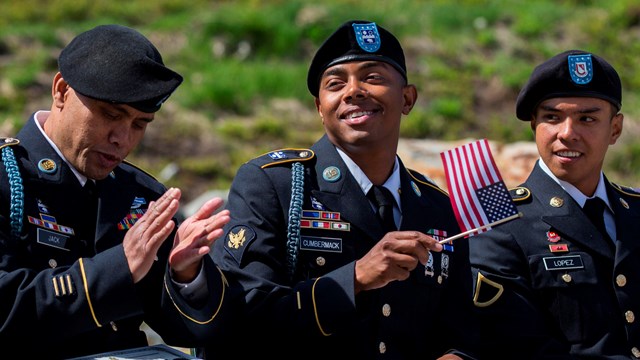 Three soldiers smiling