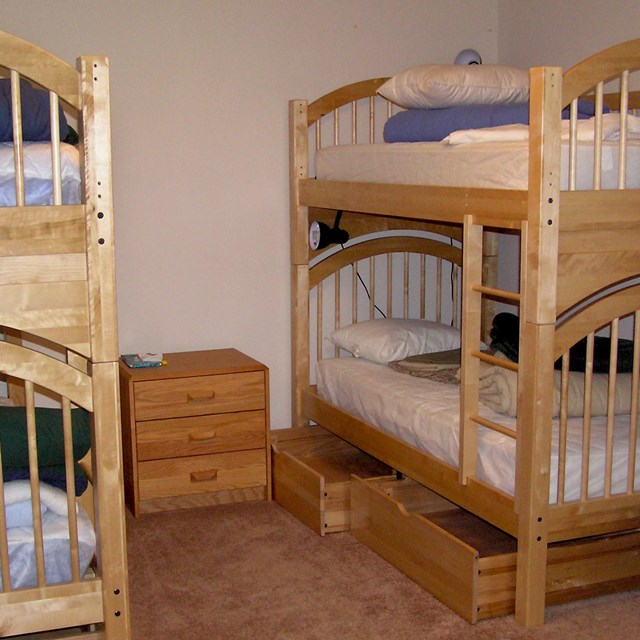Bunkbeds with wooden frames.