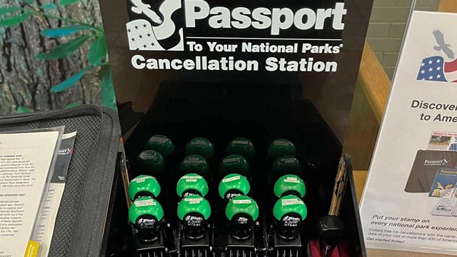 Eight passport stamps sitting on a table.