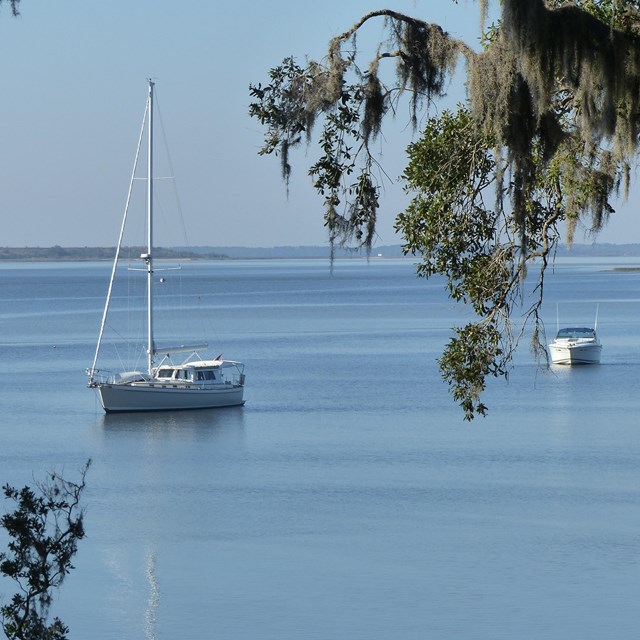 two sailboats anchor in the sound 