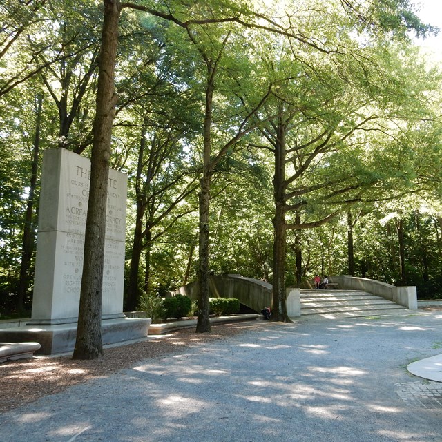 Monument, bridge, and walkways through woods of Theodore Roosevelt Island