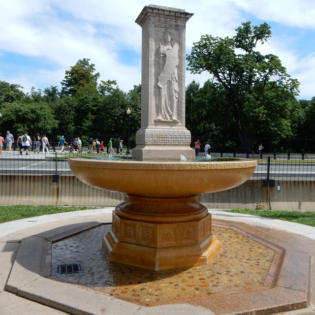 The Butt-Millet Memorial Fountain is a rectangular sculpture on a round basin