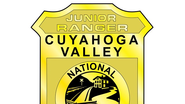 An illustration of the Cuyahoga Valley National Park Junior Ranger badge in the shape of a shield