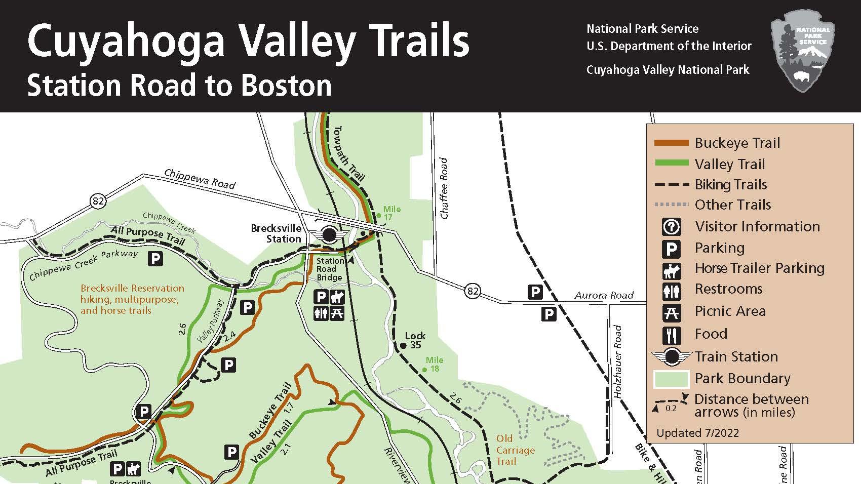 Green and white map with black bar at top, roads and trails wind through the green park area.