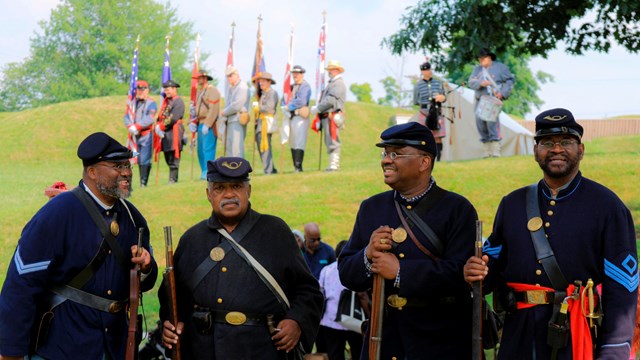 Civil War reenactors pose for group photo at Fort Stevens. 