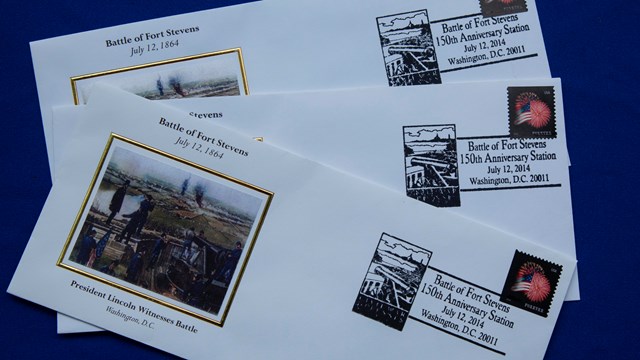 A close-up of letters promoting the anniversary of the Battle of Fort Stevens. 