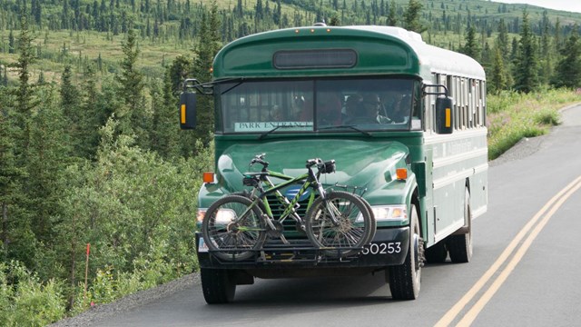 A bus driving down a road