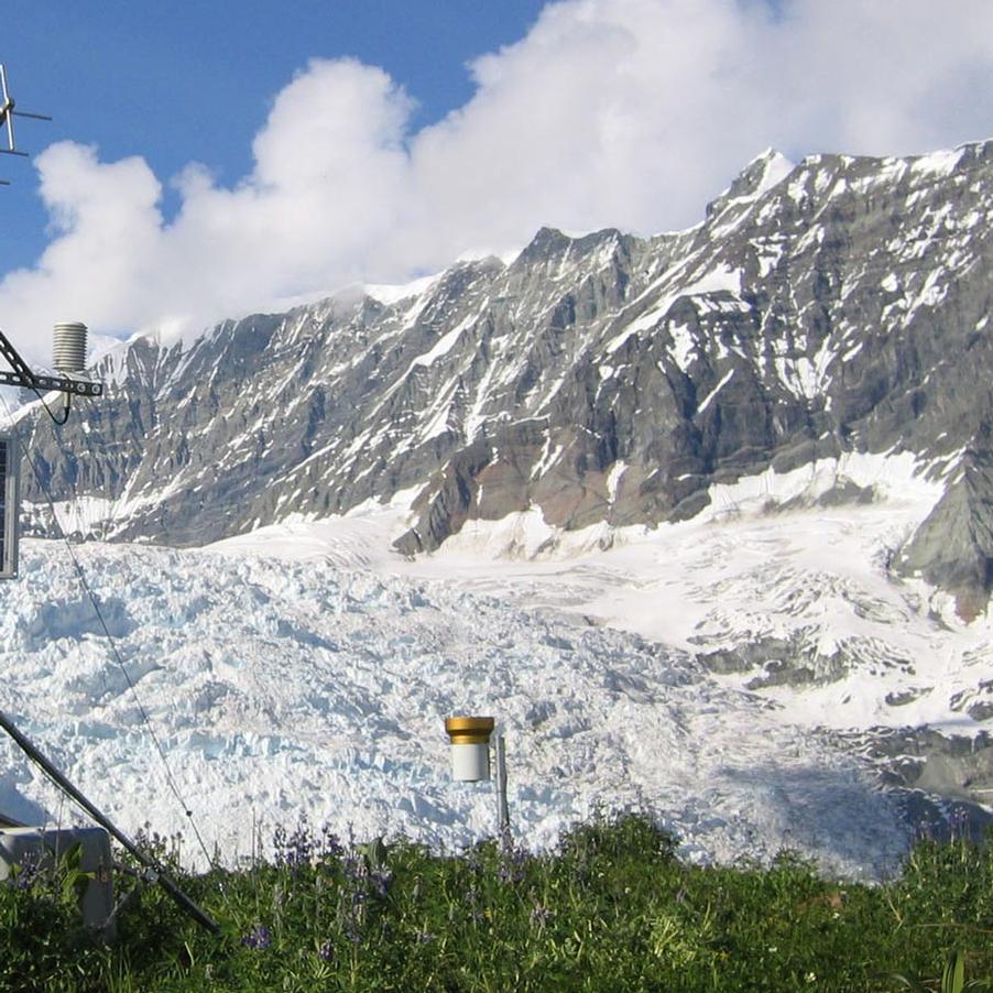 a climate station sits in front of a glacier