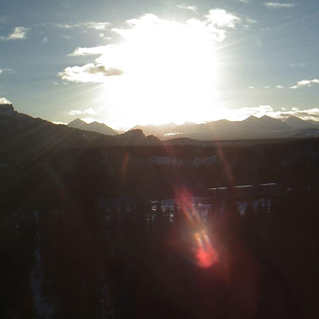 sun rising over mountains